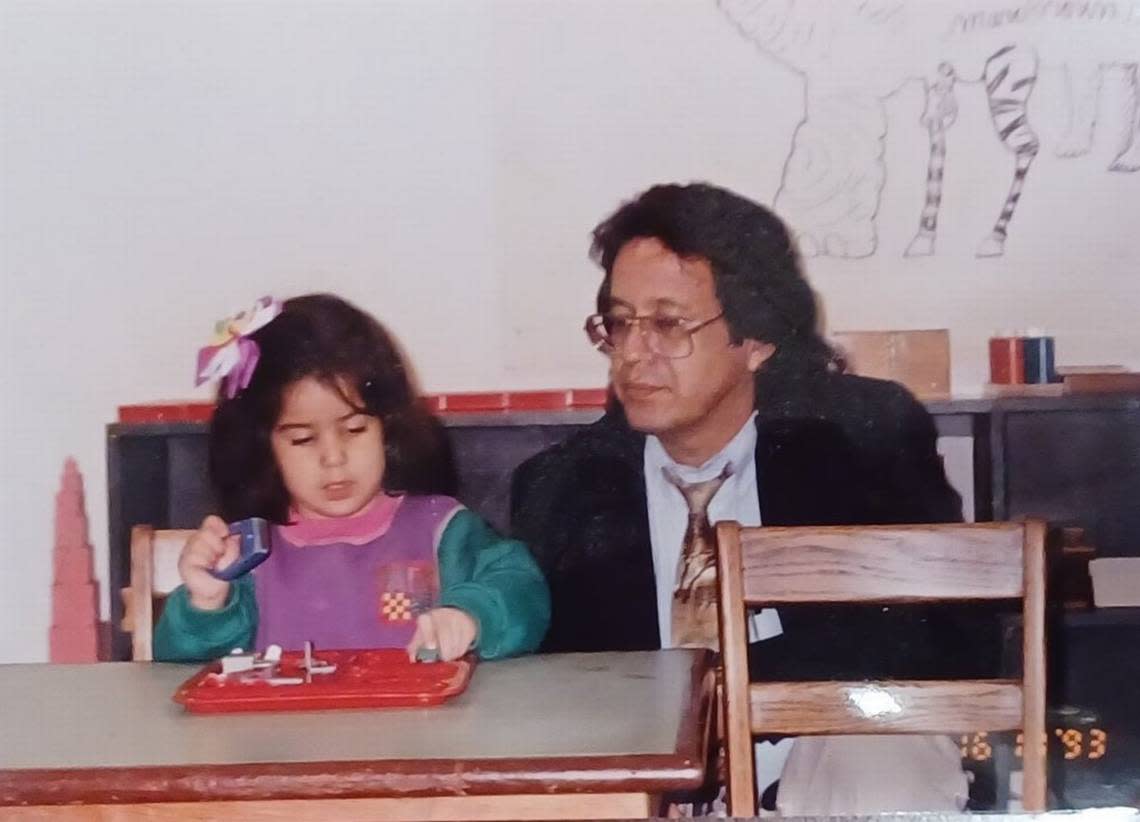 Rufino Mendoza Jr. visits with his 4-year-old daughter, Rebecca Mendoza, 4, at Clayton House Montessori in 1993.