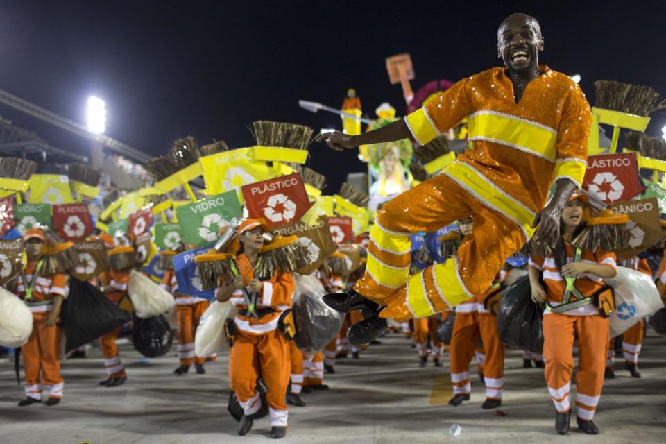 Brazilian garbage collector and dancer Renato Sorriso from the Academicos do Grande Rio samba school parades during carnival celebrations at the Sambadrome in Rio de Janeiro, Brazil, Tuesday, Feb. 12, 2013. (AP Photo/Felipe Dana)