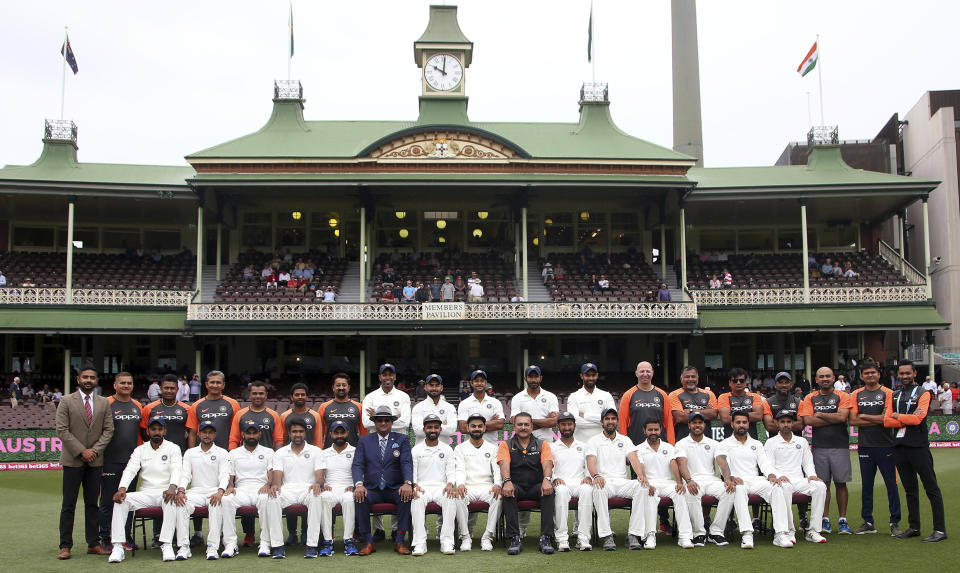 The Indian cricket team and support staff pose for a photo before play against Australia on day 5 of their cricket test match in Sydney, Monday, Jan. 7, 2019. (AP Photo/Rick Rycroft)