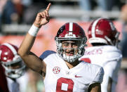 FILE - Alabama quarterback Bryce Young (9) during warm ups before the start of an NCAA college football game against Auburn Saturday, Nov. 27, 2021, in Auburn, Ala. Alabama is No. 1 in the preseason AP Top 25 for the second straight season. (AP Photo/Butch Dill, File)