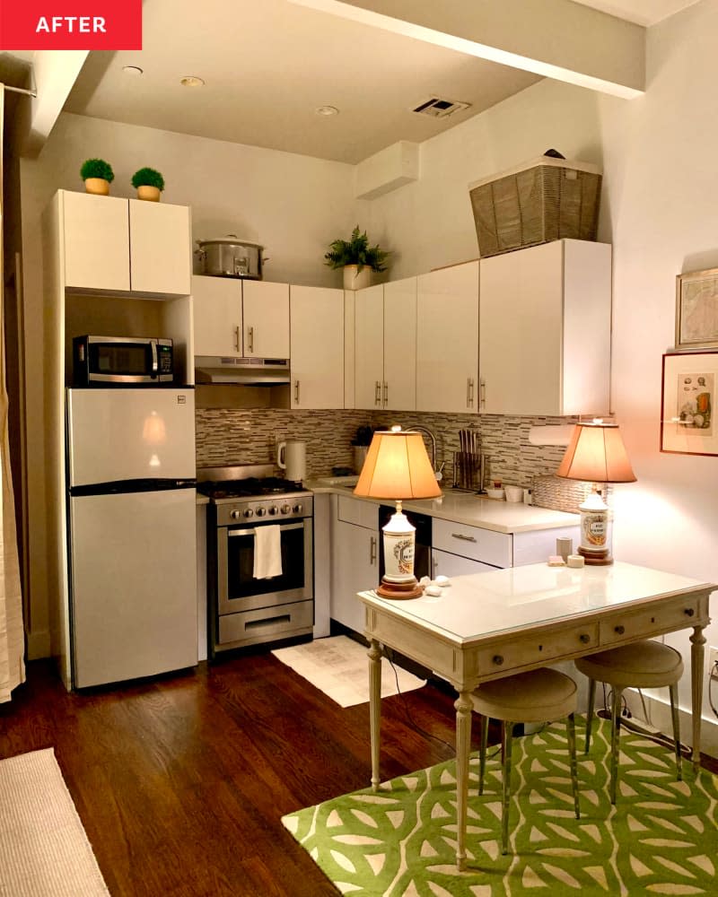 After: a kitchen with white cabinets and stainless steel appliances