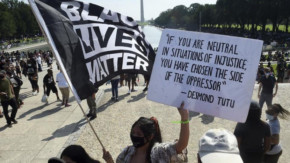 In this Aug. 28, 2020, file photo, demonstrators gather near the Lincoln Memorial as final preparations are made for the March on Washington, in Washington, on the 57th anniversary of the Rev. Martin Luther King Jr.’s “I Have A Dream” speech. (Olivier Douliery/Pool Photo via AP, File)