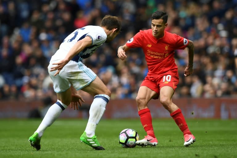 Liverpool are one of the teams Manchester United hope to catch, but fuelled by the form of Philippe Coutinho (R) they have won five times in a seven-match unbeaten run