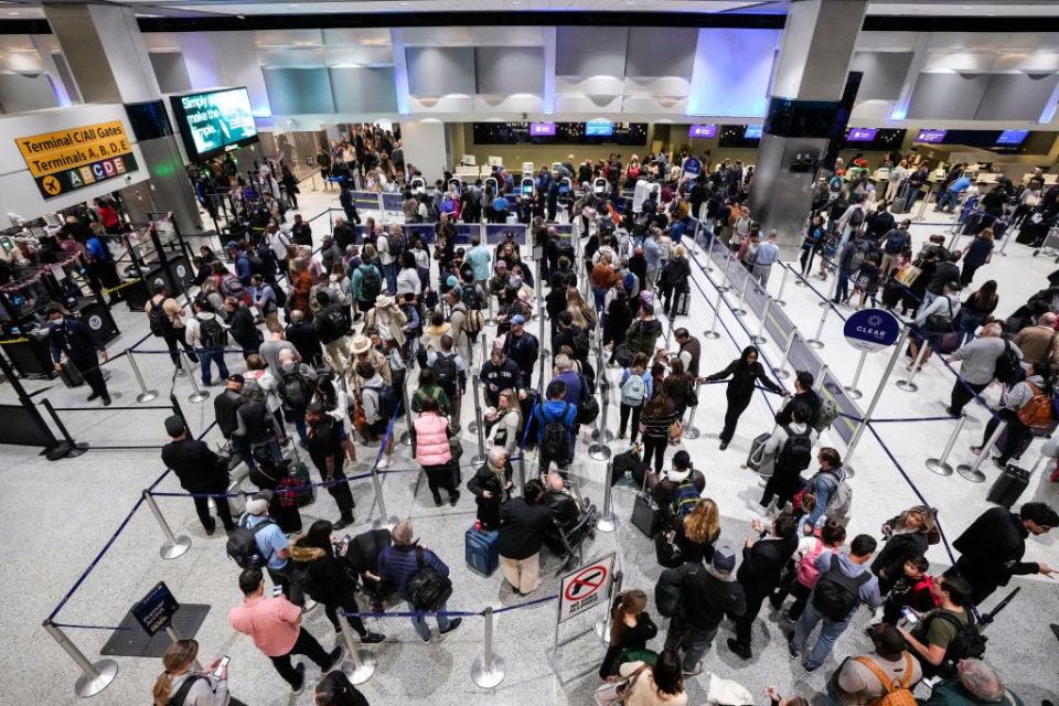 Passengers make their way through the security lines at George Bush Intercontinental Airport in Houston.