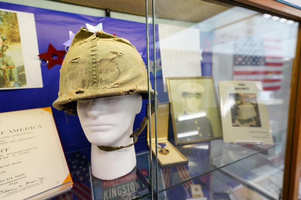 The helmet of Hawthorne resident Lance Cpl. William G. Dutches, who was killed in the Vietnam War, on display at the Louis Bay 2nd Library & Community Center in Hawthorne on Monday, May 22, 2023. "Betty Lou" and a date are written on the front.