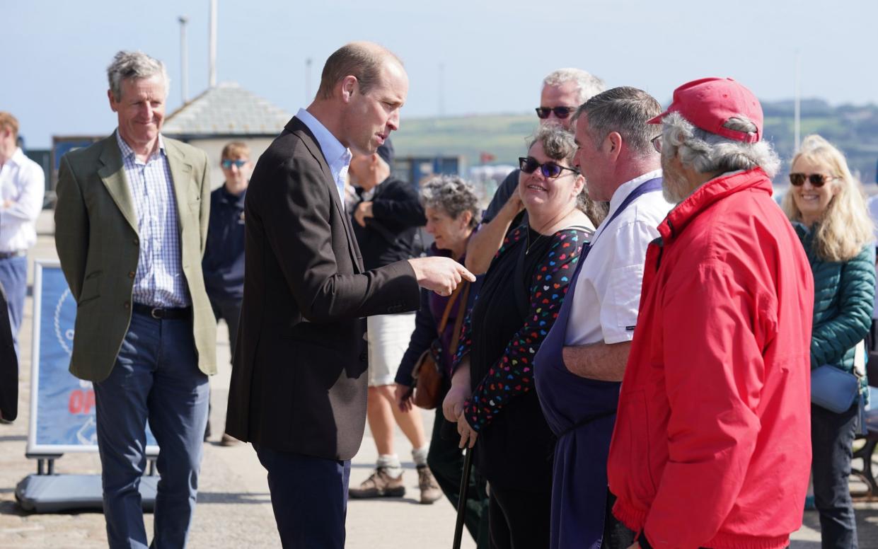 The Prince stopped to pass the time of day with locals who lined up to meet him
