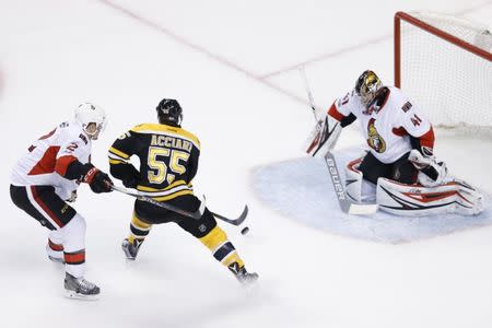 Apr 23, 2017; Boston, MA, USA; Boston Bruins center Noel Acciari (55) is defended by Ottawa Senators defenseman Dion Phaneuf (2) in front of goalie Craig Anderson (41) during the first period of game six of the first round of the 2017 Stanley Cup Playoffs at TD Garden. Mandatory Credit: Greg M. Cooper-USA TODAY Sports