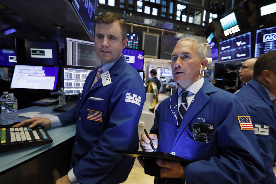 Specialist Thomas Schreck, left, and trader Timothy Nick work on the floor of the New York Stock Exchange, Tuesday, May 28, 2019. Stocks are rising at the open on Wall Street Tuesday, led by technology and consumer-focused companies. (AP Photo/Richard Drew)