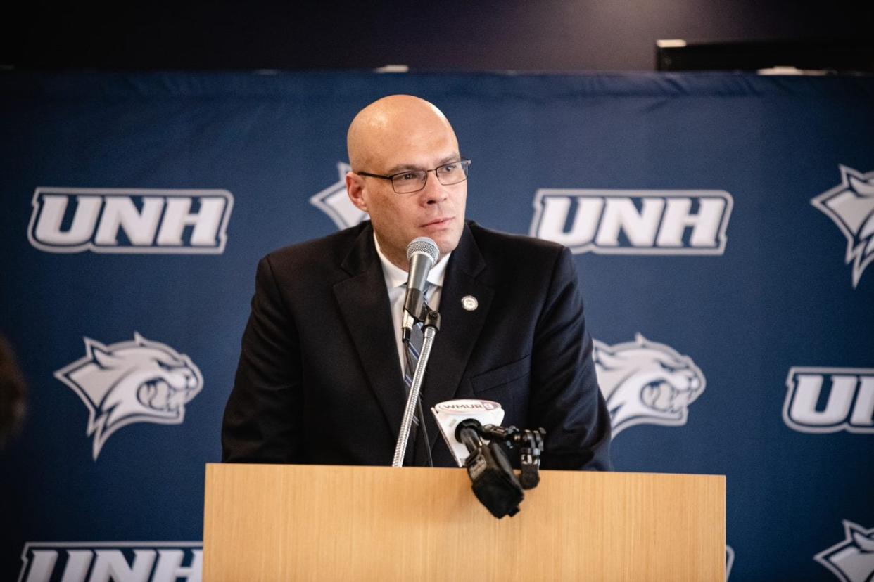 Nathan Davis, the new men's basketball coach at the University of New Hampshire, speaks during Friday's introductory press conference.