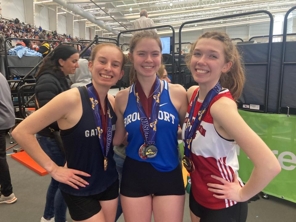 Kyra Pellegrino, left, Desilets Dubois, center, and Alexa Governor are all smiles after producing top-five finishes in the state racewalk.