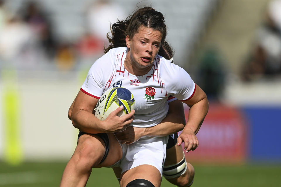 Abbie Ward of England is tackled during the women's rugby World Cup semifinal between Canada and England at Eden Park in Auckland, New Zealand, Saturday, Nov.5, 2022. (Andrew Cornaga/Photosport via AP)