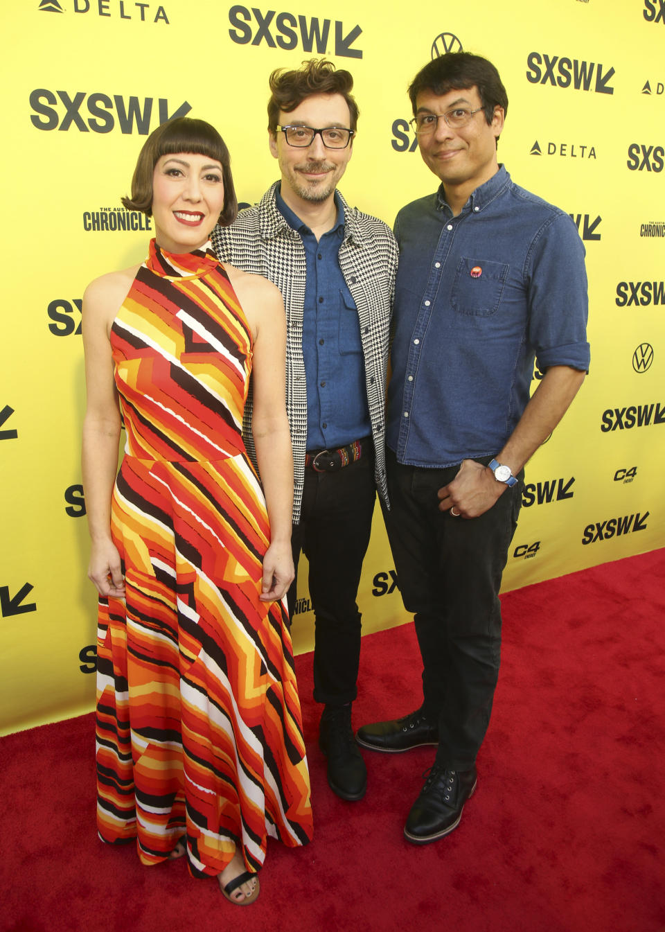 The Octopus Project's Yvonne Lambert, Josh Lambert and Toto Miranda, from left, arrive for the Texas premiere of "Sasquatch Sunset" at the Paramount Theatre during the South by Southwest Film Festival on Monday, March 11, 2024, in Austin, Texas. (Photo by Jack Plunkett/Invision/AP)