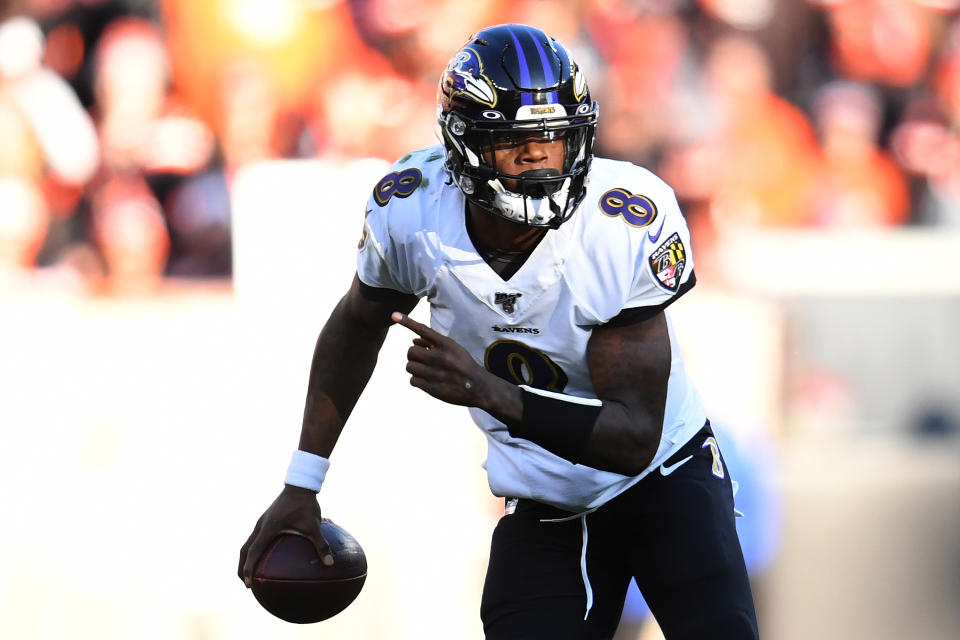 Lamar Jackson and the Baltimore Ravens earned some playoff rest, as they locked up a first-round bye by beating the Browns in Week 16. (Photo by Jason Miller/Getty Images)