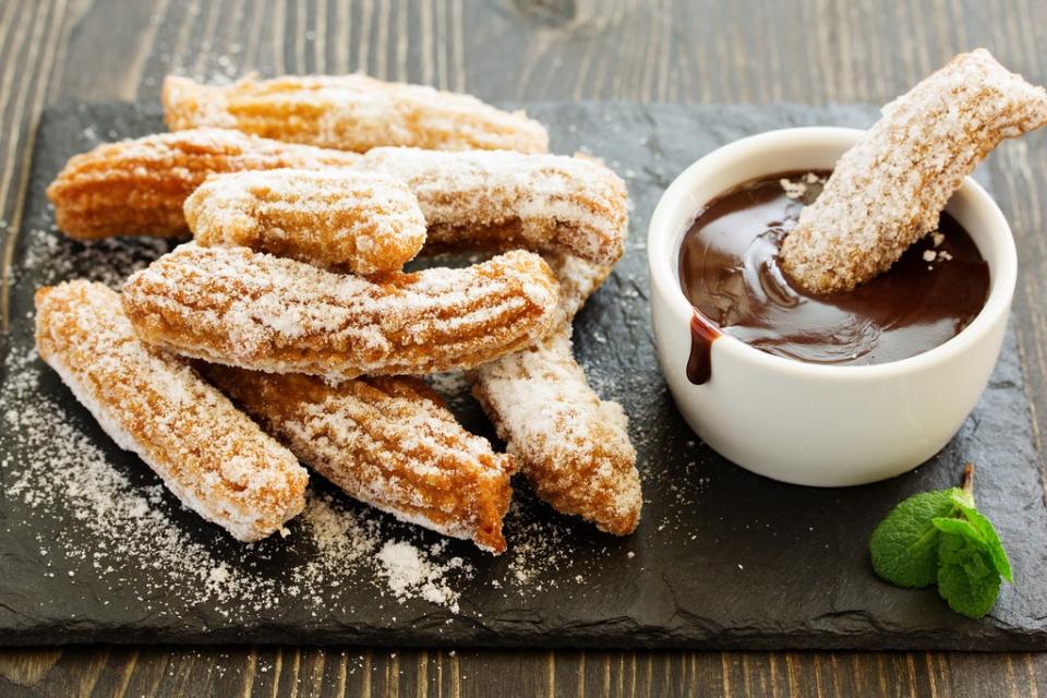 Churros are a must-eat in Seville and can be found in most cafes (Getty/iStock)