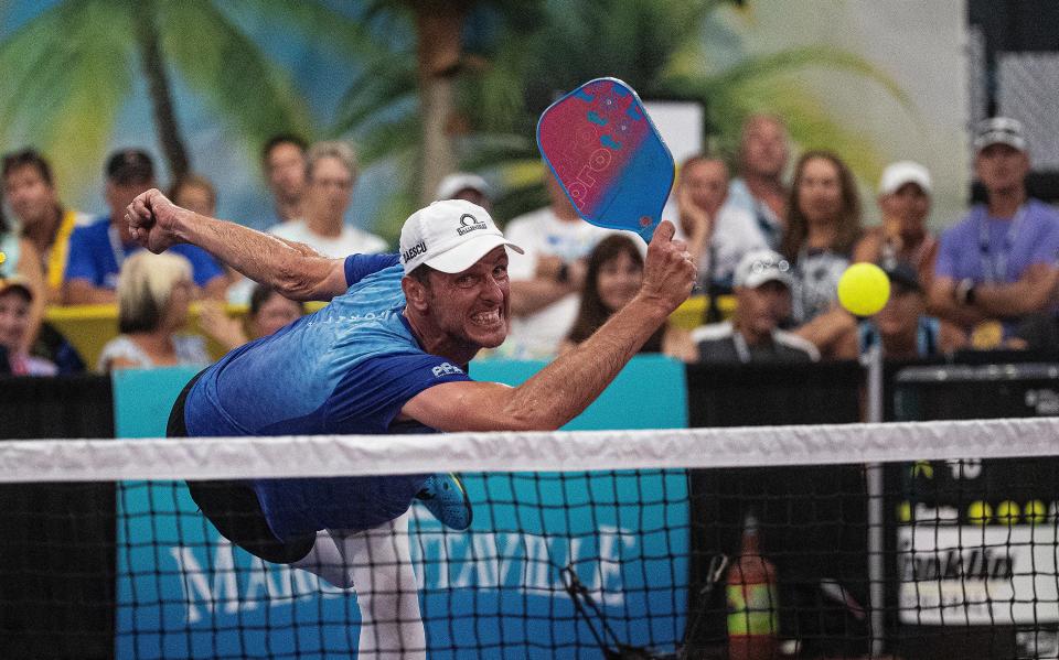 Andrei Daescu returns the ball during the pro doubles final at the Minto US Open Pickleball Championships in Naples on Saturday, April 20, 2024. His team came up short in the finals.