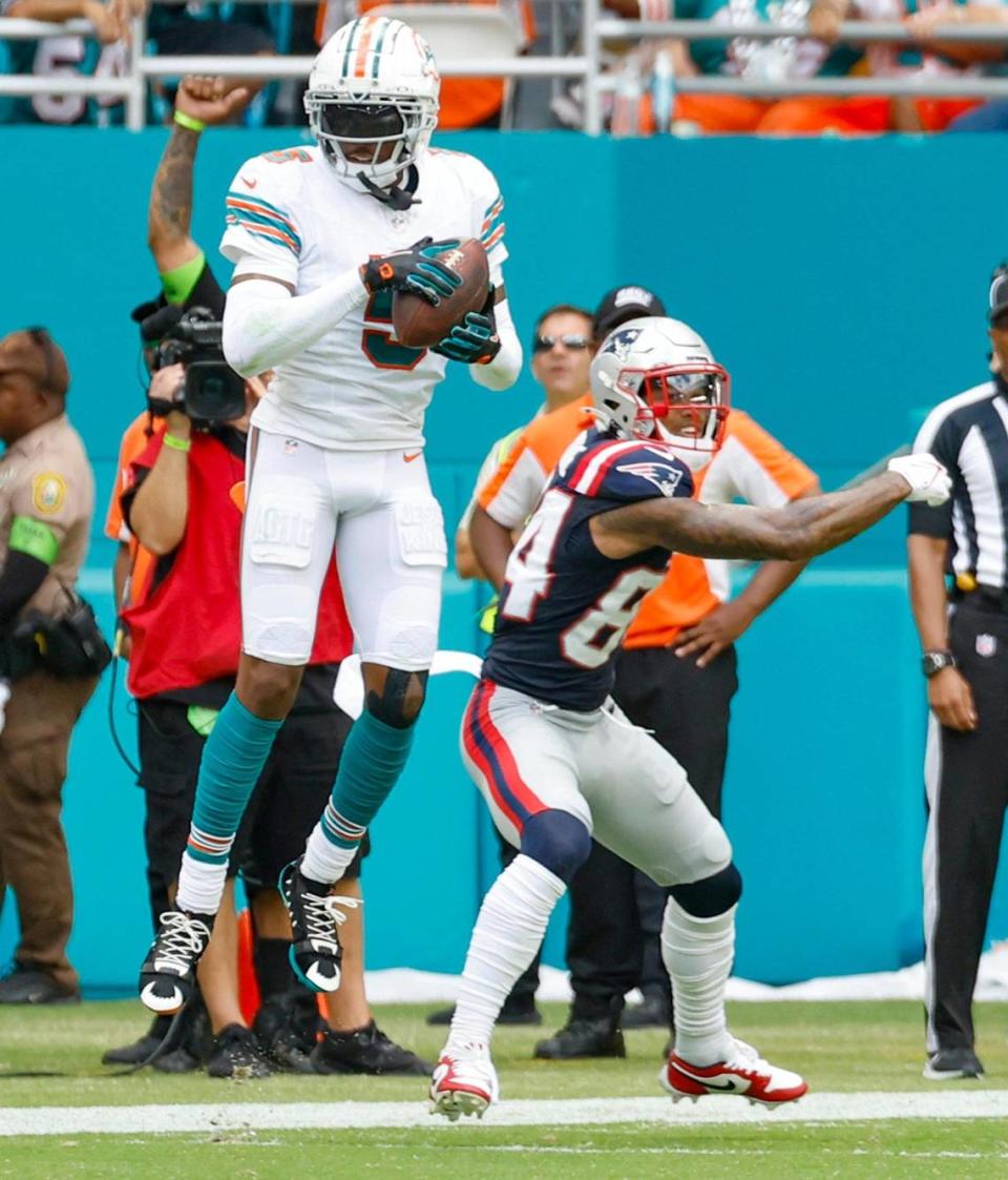 Miami Dolphins cornerback Jalen Ramsey (5) intercepts a pass intended for New England Patriots receiver Kendrick Bourne in the second quarter at Hard Rock Stadium in Miami Gardens on Sunday, October 29, 2023.