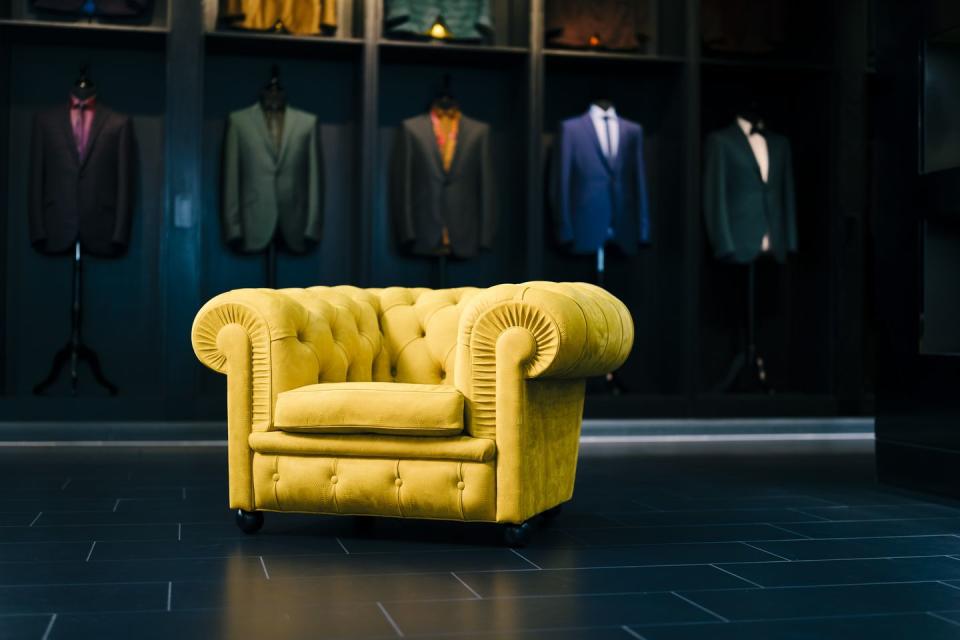 a yellow chair in a storefront