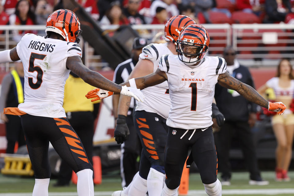 Cincinnati Bengals wide receiver Ja'Marr Chase (1) is congratulated by wide receiver Tee Higgins (5) after scoring against the San Francisco 49ers during the second half of an NFL football game in Santa Clara, Calif., Sunday, Oct. 29, 2023. (AP Photo/Josie Lepe)