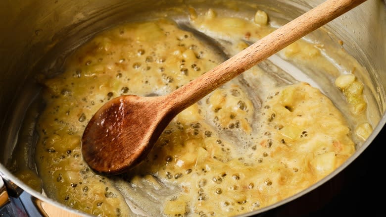 A blonde roux being stirred