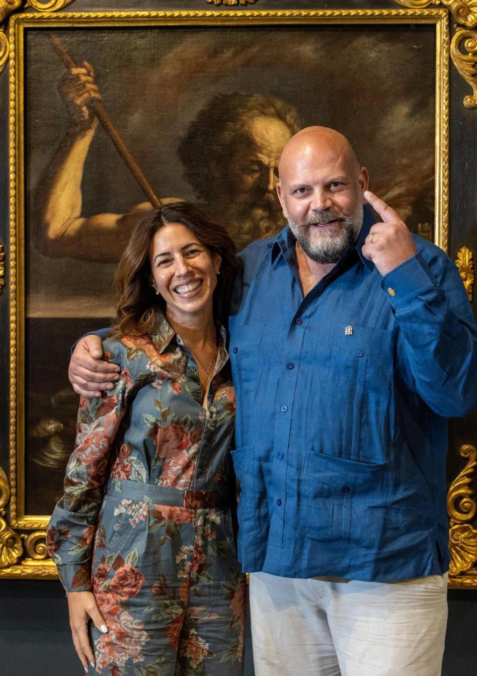 Miami, Florida, Sept. 5, 2023 - Daisy Beatriz Díaz, left, and Federico Gandolfi Vannini, right, at the Olga M. & Carlos A. Saladrigas Art Gallery at Belen Jesuit Preparatory School. The couple brought paintings from their Florence, Italy, gallery to be showcased at Belen in an exhibit, ‘Faith, Beauty, and Devotion: Medieval, Renaissance, and Baroque Paintings.’