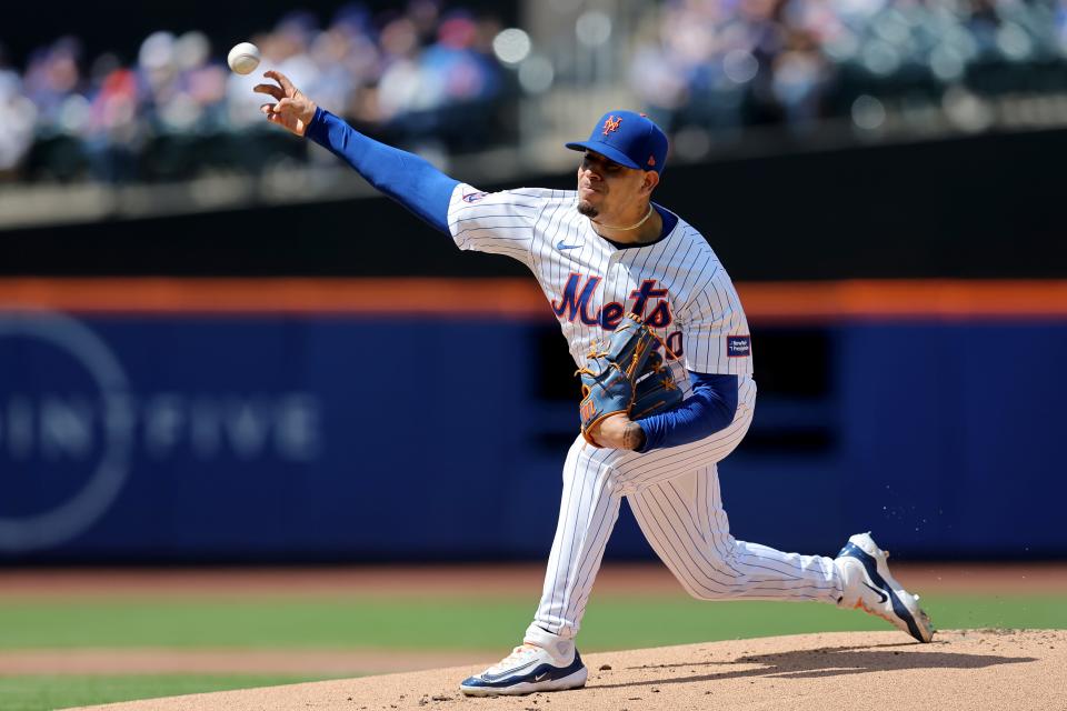 Apr 14, 2024; New York City, New York, USA; New York Mets starting pitcher Jose Butto (70) pitches against the Kansas City Royals during the first inning at Citi Field. Mandatory Credit: Brad Penner-USA TODAY Sports