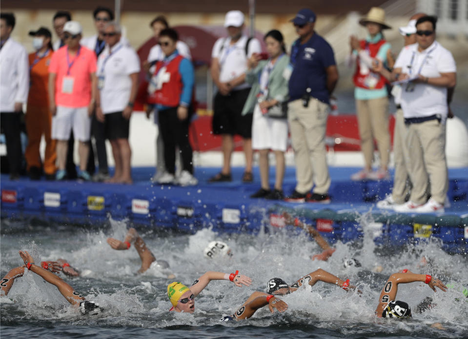 Swimmers compete during the women's 5km open water swim at the World Swimming Championships in Yeosu, South Korea, Wednesday, July 17, 2019. (AP Photo/Mark Schiefelbein)