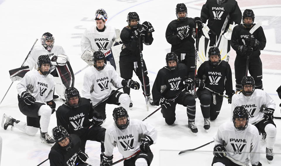 Montreal players look on during Professional Women's Hockey League (PWHL) training camp in Montreal, Saturday, Nov. 18, 2023. (Graham Hughes/The Canadian Press via AP)