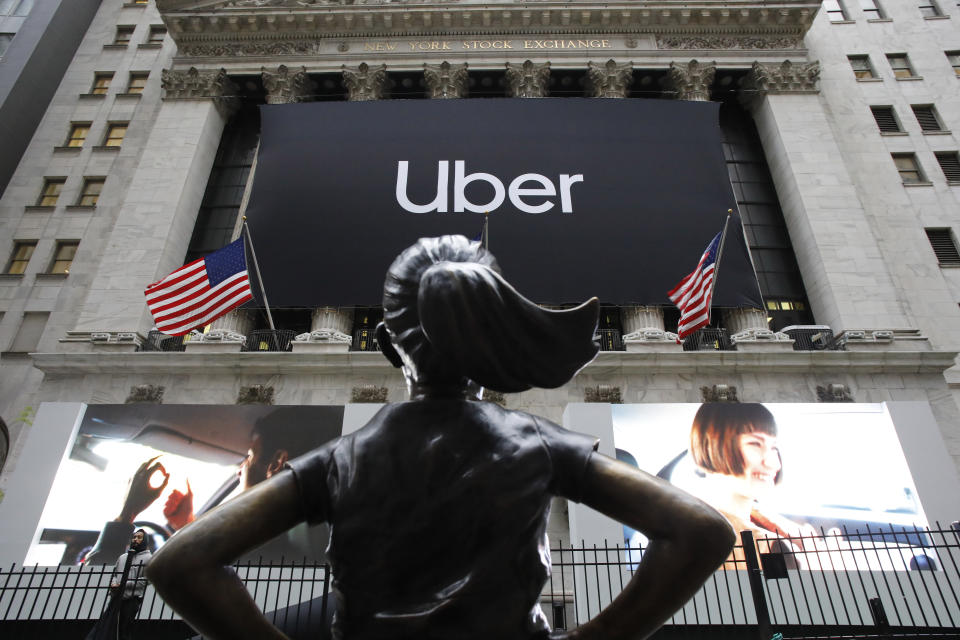 The statue of Fearless Girl stands in front of the New York Stock Exchange before Uber, the world's largest ride-hailing service, holds its initial public offering, Friday, May 10, 2019. (AP Photo/Mark Lennihan)