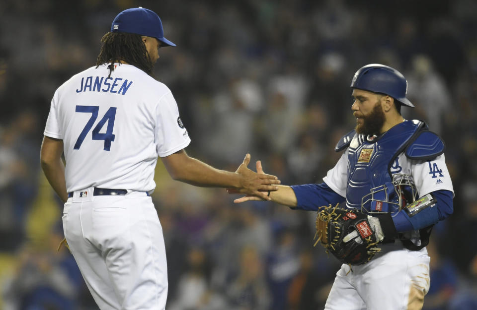 LOS ANGELES, CA - MAY 30: Kenley Jansen #74 and Russell Martin #55 of the Los Angeles Dodgers celebrate after the final out in a 2-0 win over the New York Mets at Dodger Stadium on May 30, 2019 in Los Angeles, California. (Photo by John McCoy/Getty Images)