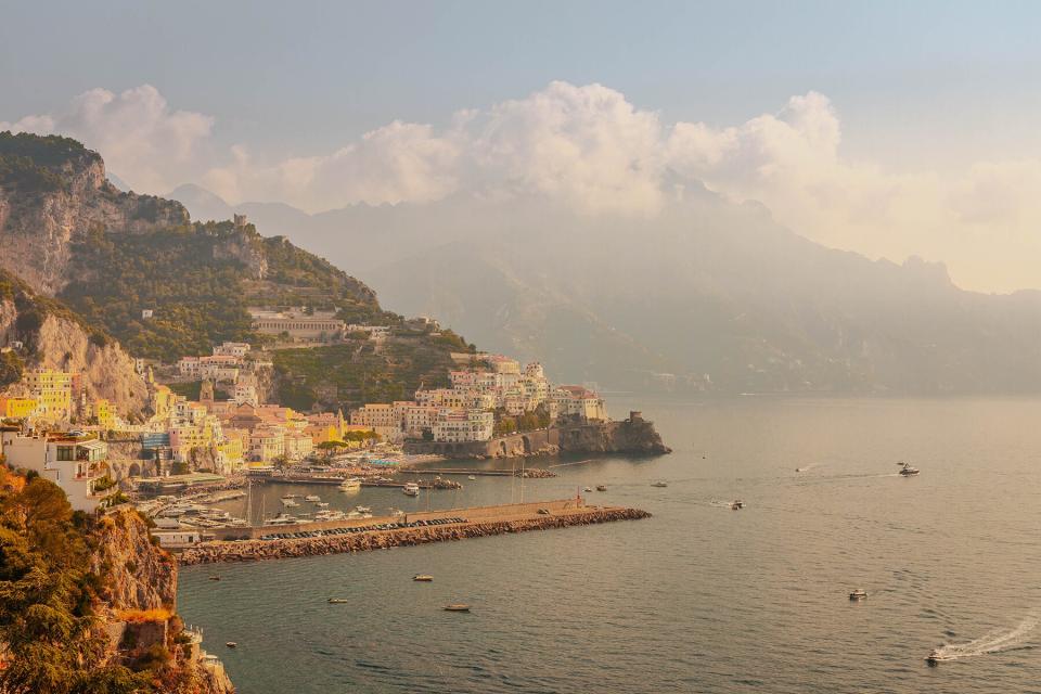 Te beautiful Amalfi town with shoreline during golden hour during summer in Italy.