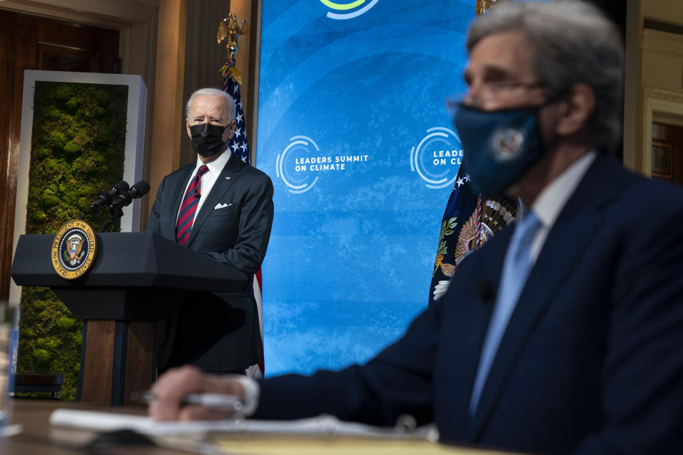 President Joe Biden and Special Presidential Envoy for Climate John Kerry listen during the virtual Leaders Summit on Climate, from the East Room of the White House, Thursday, April 22, 2021, in Washington. (AP Photo/Evan Vucci)