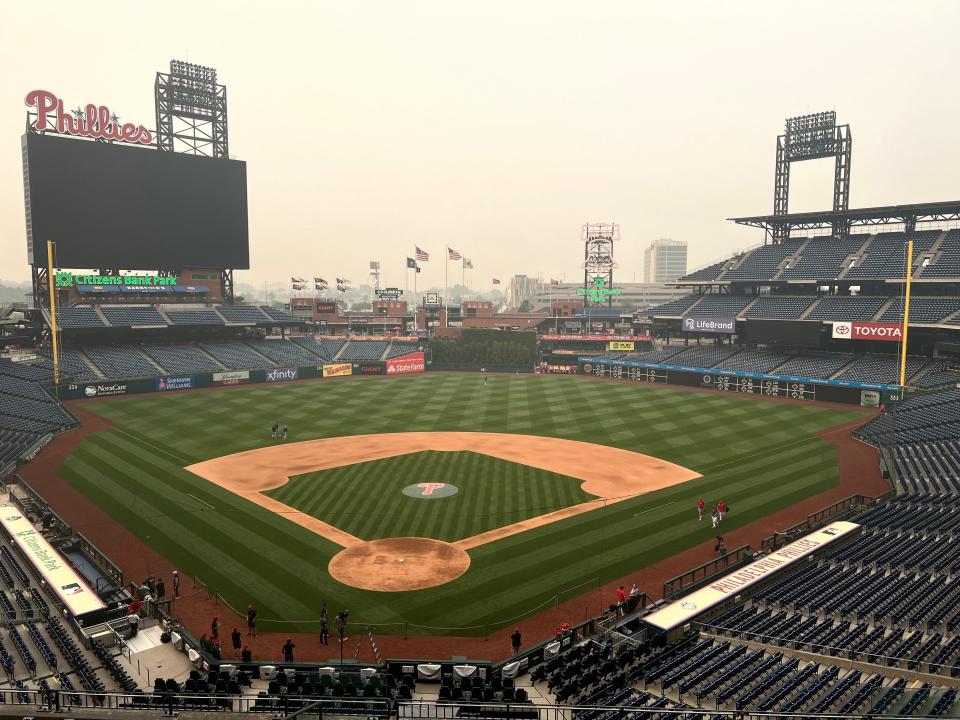 The downtown Philadelphia skyline, normally visible from the press box at Citizens Bank Park, is obscured by the poor air quality on Wednesday, June 7, 2023.