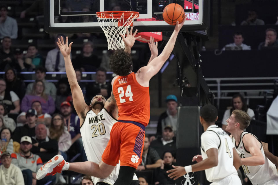 Clemson center PJ Hall (24) shoots against Wake Forest forward Davion Bradford (20) during the first half of an NCAA college basketball game in Winston-Salem, N.C., Tuesday, Jan. 17, 2023. (AP Photo/Chuck Burton)