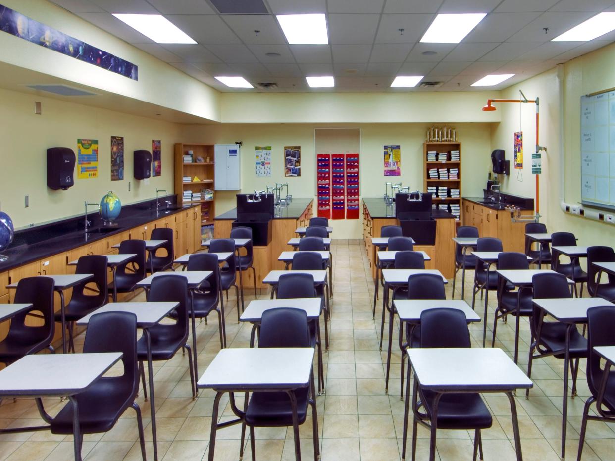 An empty classroom with facilities for science classes