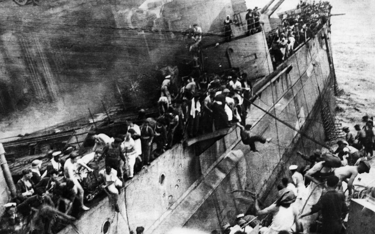 Crew members abandon the sinking HMS Prince of Wales in 1941 - ullstein bild/ullstein bild via Getty Images