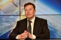 SpaceX founder and chief engineer Elon Musk reacts at a post-launch news conference to discuss the SpaceX Crew Dragon astronaut capsule in-flight abort test at the Kennedy Space Center