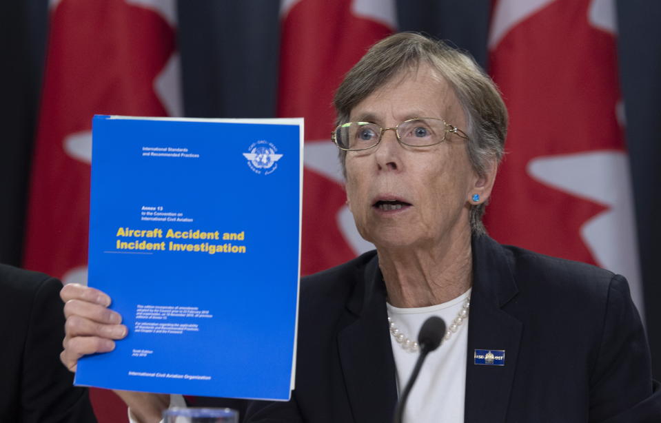 Canada's Transportation Safety chair Kathy Fox holds up a document as she speaks about the Iran plane crash during a news conference in Ottawa, Monday, January 13, 2020 (Adrian Wyld/The Canadian Press via AP)