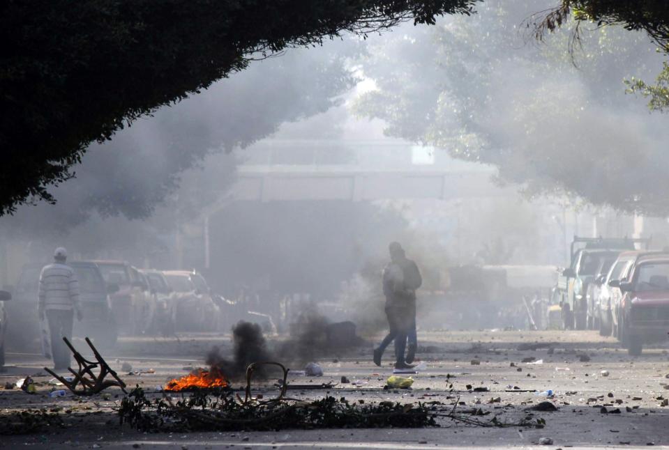 Smoke fills the area during clashes between supporters of ousted Egyptian President Mohamed Mursi and riot police at the main university in Alexandria, January 23, 2014. (REUTERS/Al Youm Al Saabi Newspaper)