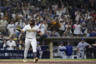 San Diego Padres' Jorge Alfaro reacts after drawing a walk with the bases loaded, allowing the winning run to score during the 10th inning against the Los Angeles Dodgers in a baseball game Tuesday, Sept. 27, 2022, in San Diego. (AP Photo/Gregory Bull)