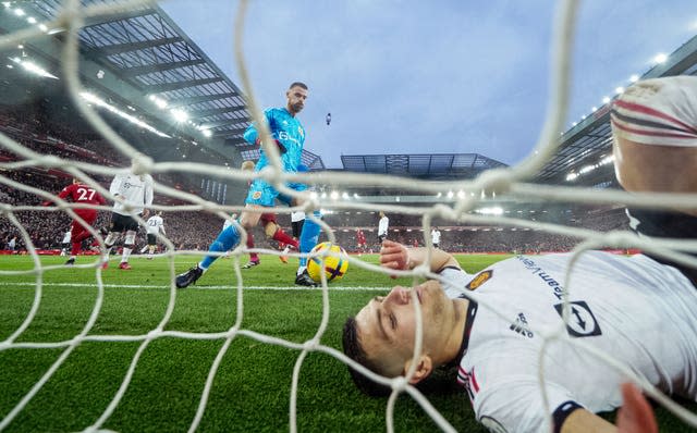 Deflated Manchester United defender Diogo Dalot lays beaten behind the goal line as Anfield erupts to celebrate Liverpool's second - scored by Darwin Nunez - during their thumping 7-0 win in March. The 20-time English champions suffered the joint heaviest defeat in their history after Roberto Firmino's late finish added to doubles from Cody Gakpo, Nunez and Mohamed Salah. United boss Erik ten Hag was furious with his side’s “unprofessional” display against their fierce rivals