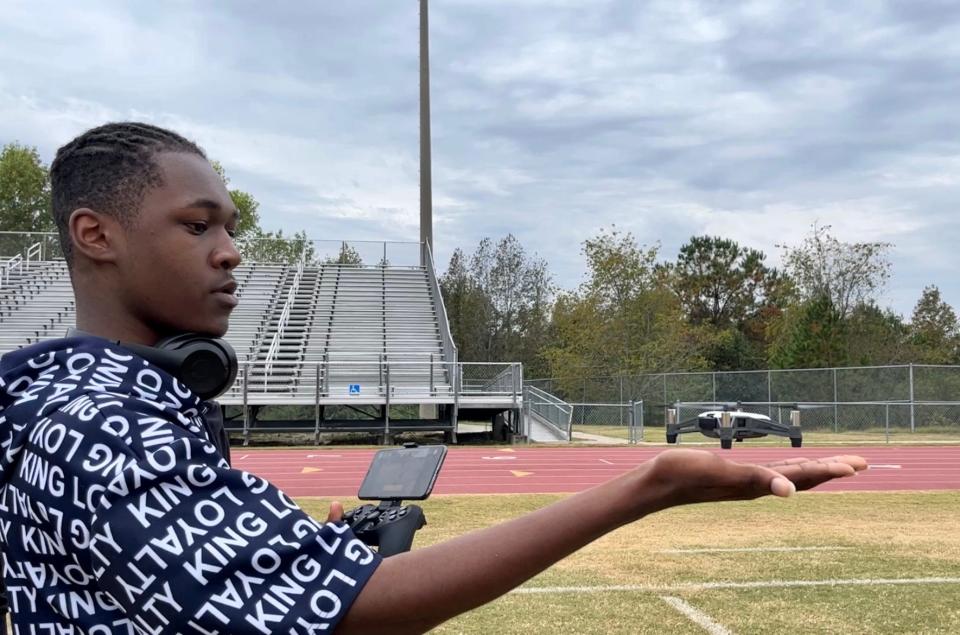 Cross Creek High School junior Leandre Abraham lands a drone on his hand during his Unmanned Aircraft Systems class on October 17, 2022 in Augusta, Georgia.