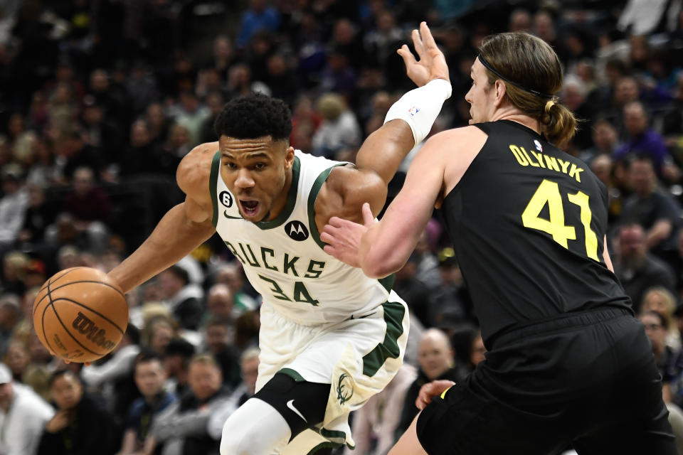 SALT LAKE CITY, UTAH - MARCH 24: Giannis Antetokounmpo #34 of the Milwaukee Bucks drives around Kelly Olynyk #41 of the Utah Jazz during the first half of a game at Vivint Arena on March 24, 2023 in Salt Lake City, Utah. NOTE TO USER: User expressly acknowledges and agrees that, by downloading and or using this photograph, User is consenting to the terms and conditions of the Getty Images License Agreement.  (Photo by Alex Goodlett/Getty Images)