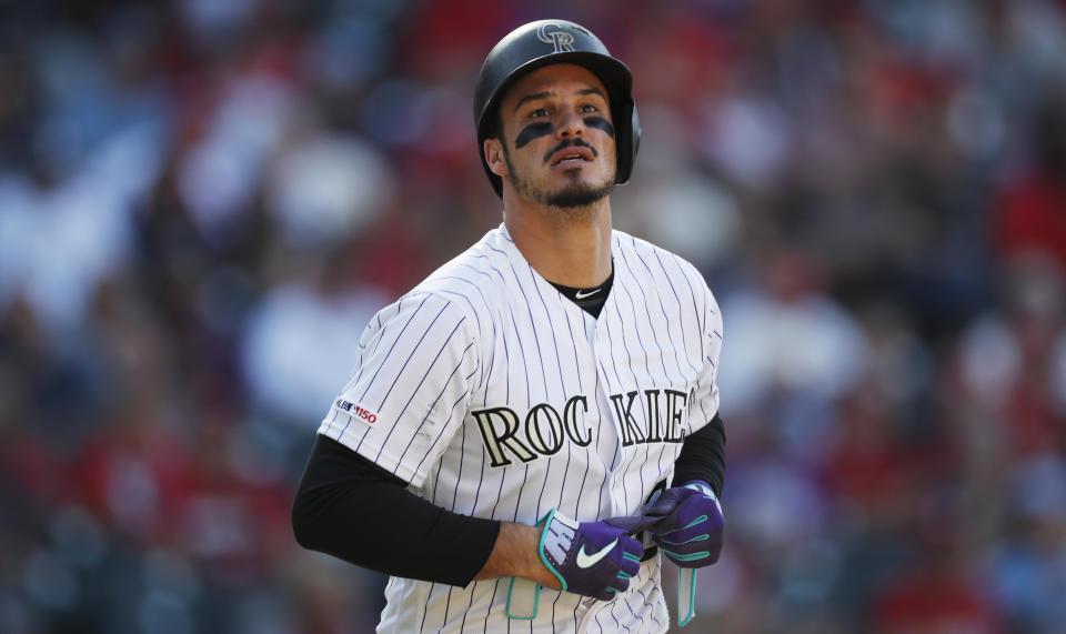 FILE - In this Sept. 12, 2019, file photo, Colorado Rockies' Nolan Arenado reacts after being put out against the St. Louis Cardinals in the eighth inning of a baseball game in Denver. Arenado, the Rockies' top player, is at odds with the team's management as spring training opens for the club. (AP Photo/David Zalubowski, File)