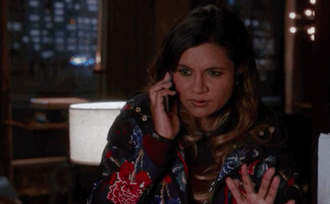 Mindy Kaling on "The Mindy Project" talking on the phone and looking confused