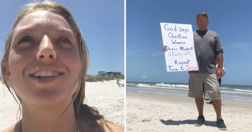 man holding up a sign on the beach