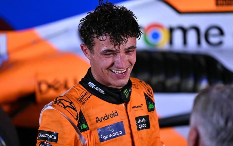 McLaren's British driver Lando Norris celebrates after winning the Formula One Singapore Grand Prix night race at the Marina Bay Street Circuit in Singapore on September 22, 2024