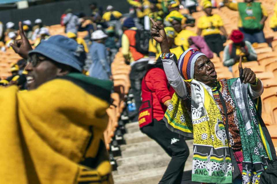 African National Congress supporters wait for South African President Cyril Ramaphosa to arrive at the Siyanqoba rally at FNB stadium in Johannesburg, South Africa, Saturday, May 25, 2024. South African will vote in the 2024 general elections on May 29. (AP Photo/Jerome Delay)