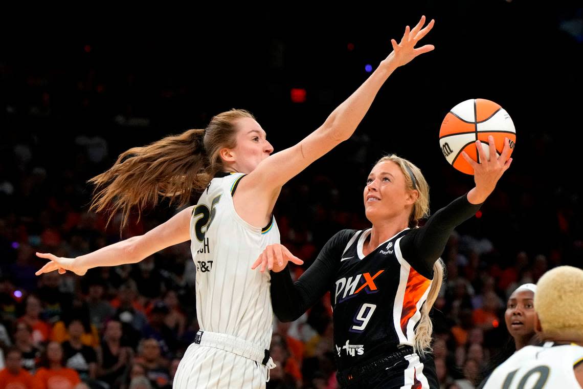 Phoenix Mercury guard Sophie Cunningham, right, shoots over Chicago Sky guard Morgan Bertsch during a WNBA game last week.