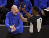 Dallas Mavericks head coach Rick Carlisle, left, reacts toward referee Sean Wright(4) after a foul call in the first half of Game 7 of an NBA basketball first-round playoff series against the Los Angeles Clippers, Sunday, June 6, 2021, in Los Angeles, Calif. (Keith Birmingham/The Orange County Register via AP)