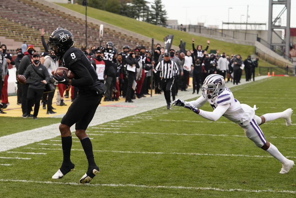 Iowa State wide receiver Joe Scates (9) catches a 33-yard touchdown pass ahead of Kansas State defensive back Justin Gardner, right, during the first half of an NCAA college football game, Saturday, Nov. 21, 2020, in Ames, Iowa. (AP Photo/Charlie Neibergall)